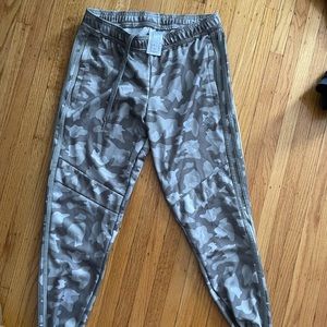 Camo Adidas track pants. Ankle zippers in the back. Size small. Worn twice.